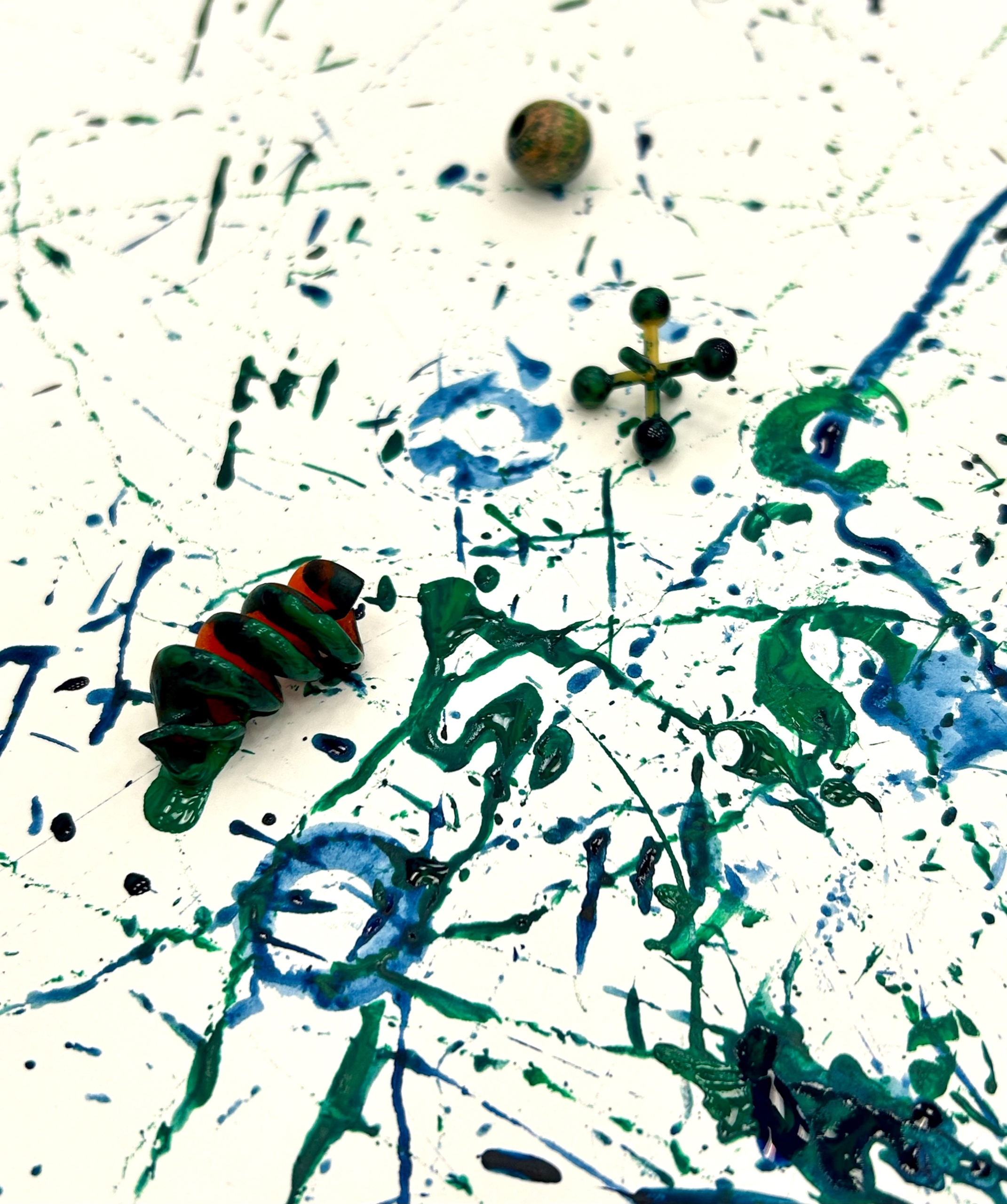 Paint splatters on a canvas.