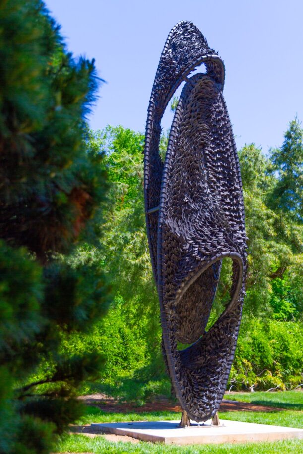 A side view of FOCI, a sculpture made of recycled rubber tires.