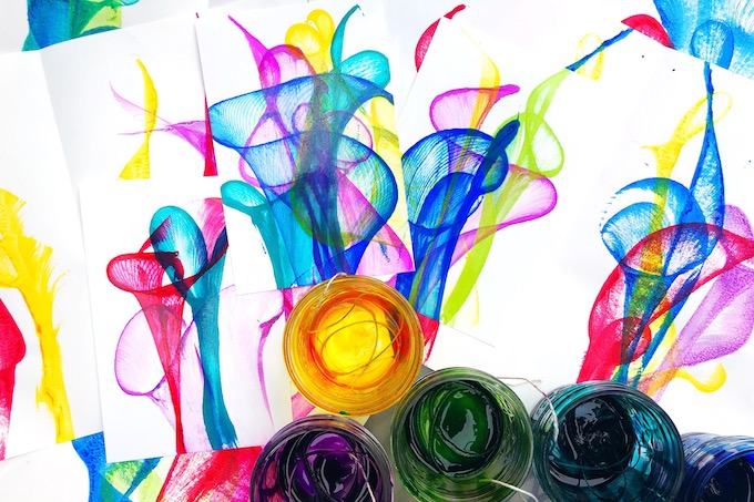 Colorful flower paintings on a piece of paper.