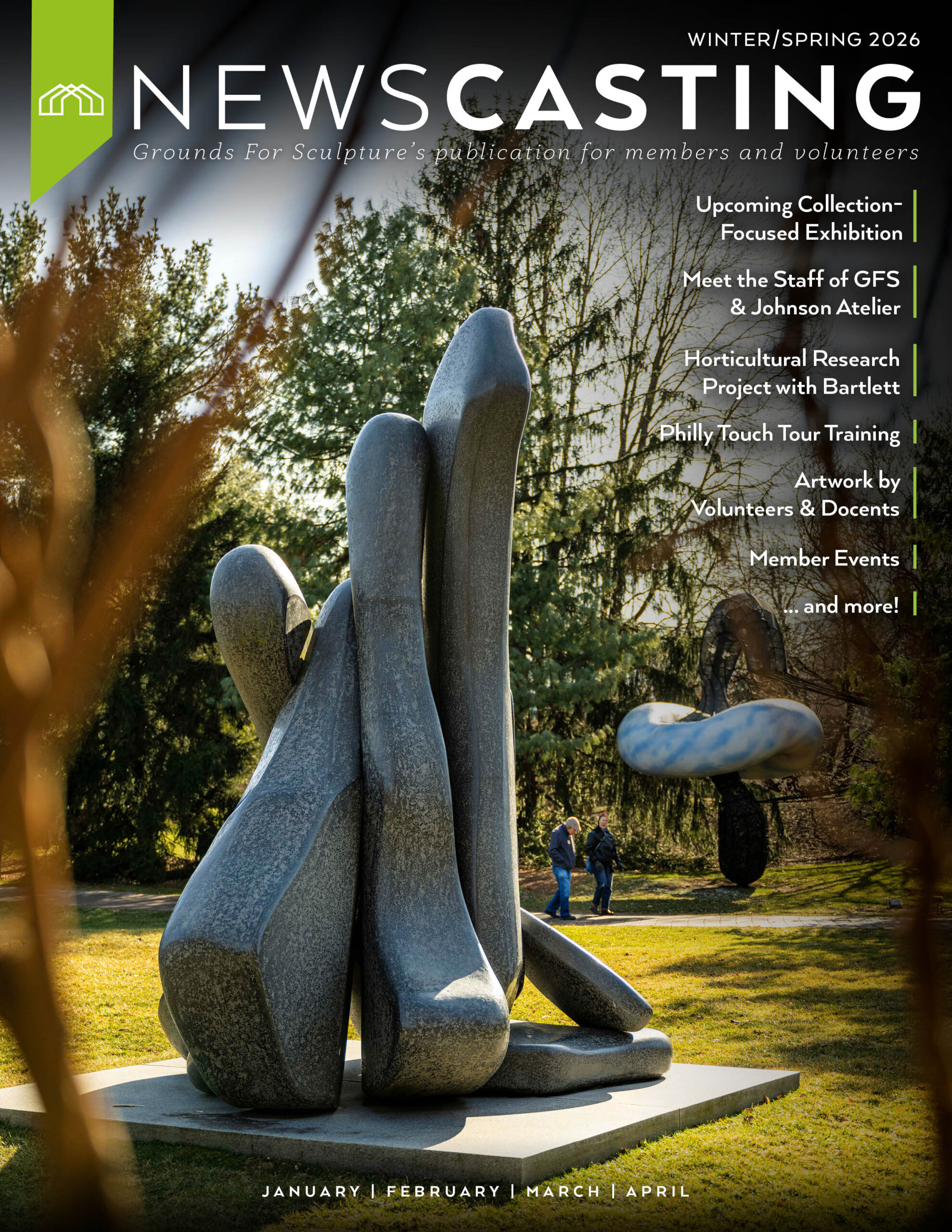 a group of people walking next to a stone structure