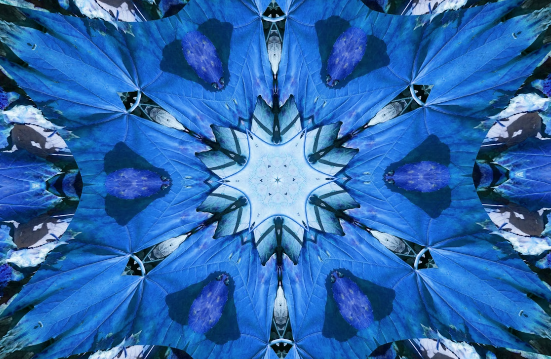 Blue kaleidoscope designs in the shape of a snowflake.