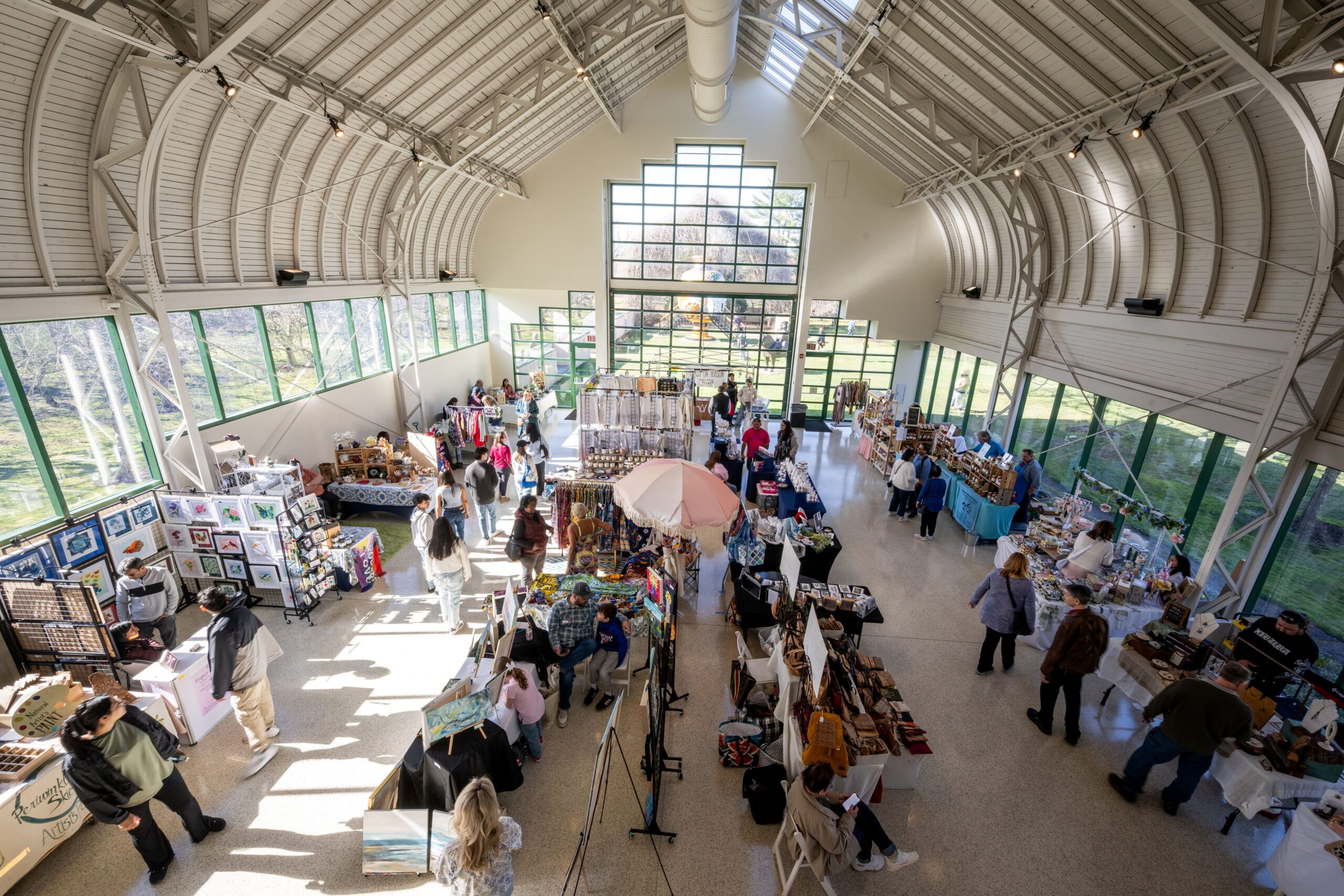An overhead shot of rows of vendors set up in the Museum Building.