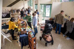 Guests shopping and talking to vendors at the Artisan Market.